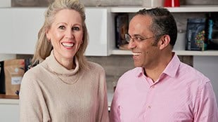 Image of two people smiling